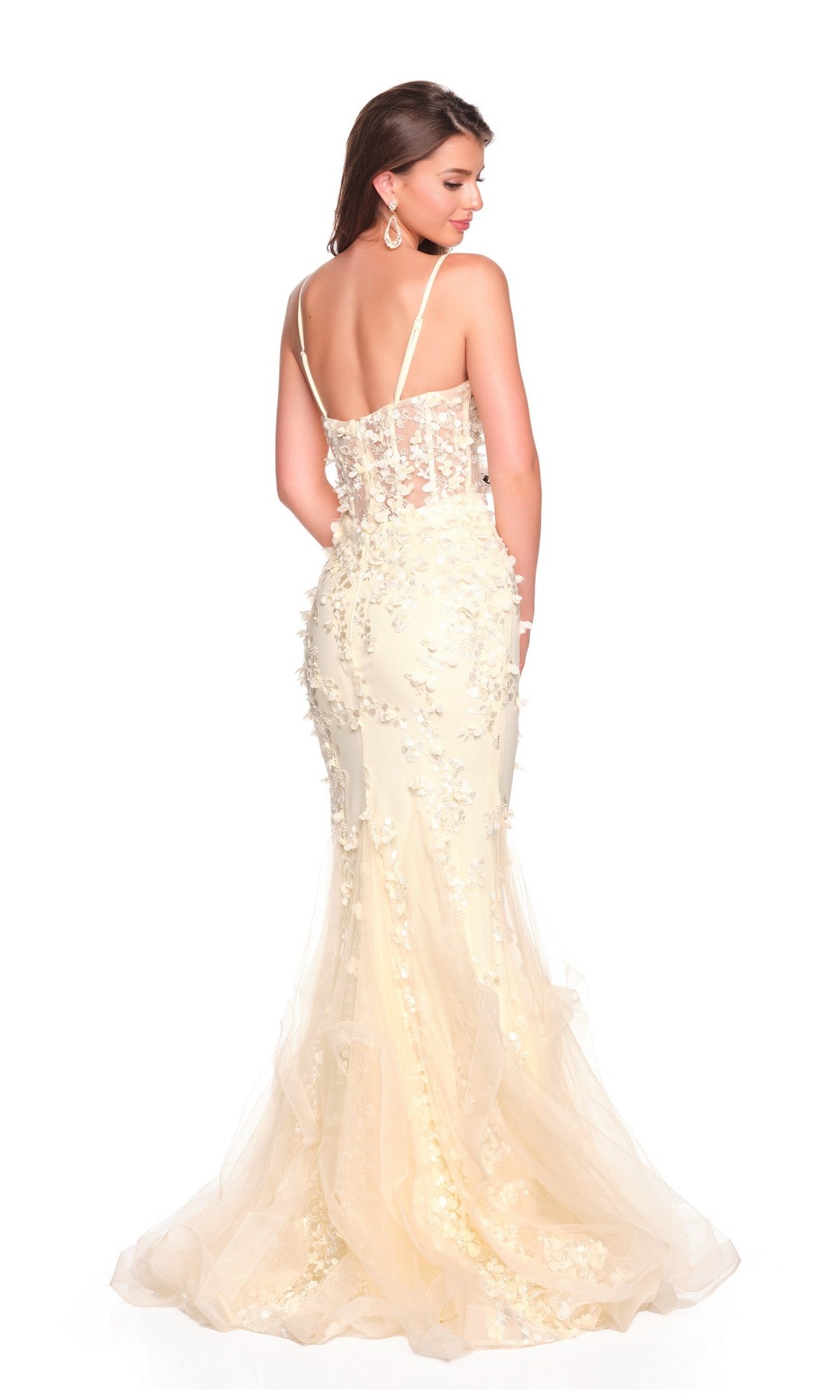 A woman poses with her back to the camera in the Dave and Johnny 12912 long prom dress, a fitted, cream-colored gown featuring thin straps and 3D floral motifs, set against a white background.